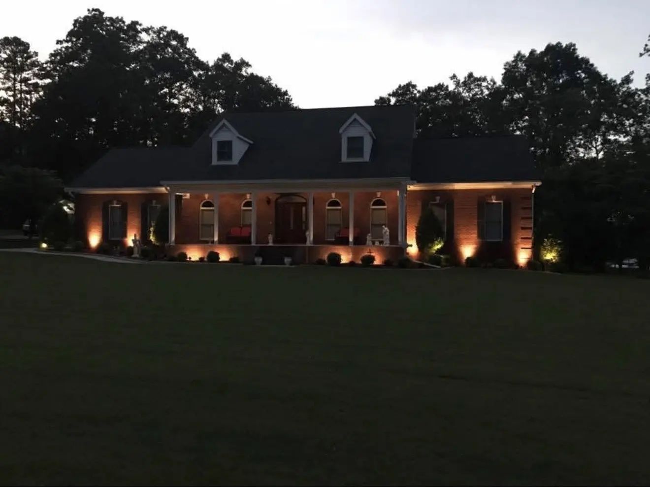 Residential outdoor lighting installed around a home