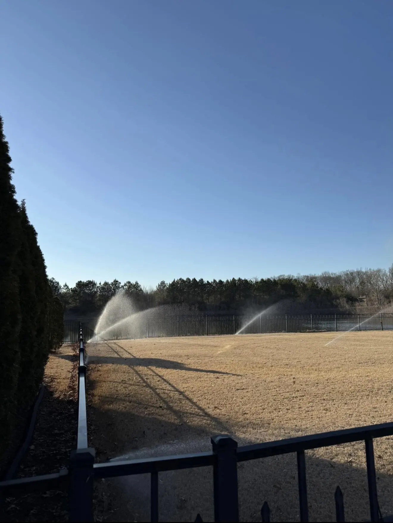 Sprinkler system running across a Huntsville lawn